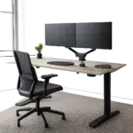 Un bureau assis-debout électrique haut de gamme dans un environnement de travail moderne et épuré. L’image met en valeur la stabilité, le confort et l’esprit ergonomique du mobilier.